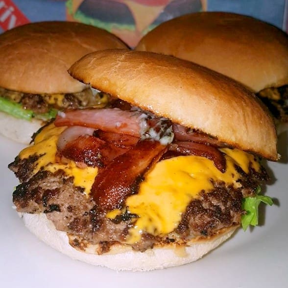 Close up of three burgers