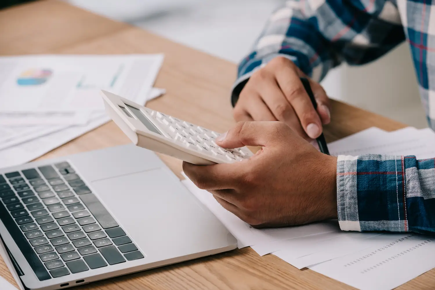 person holding calculator