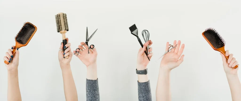 hands holding hair tools