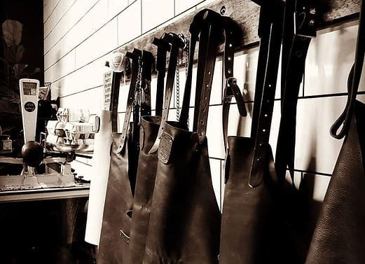 Aprons hanged on wall