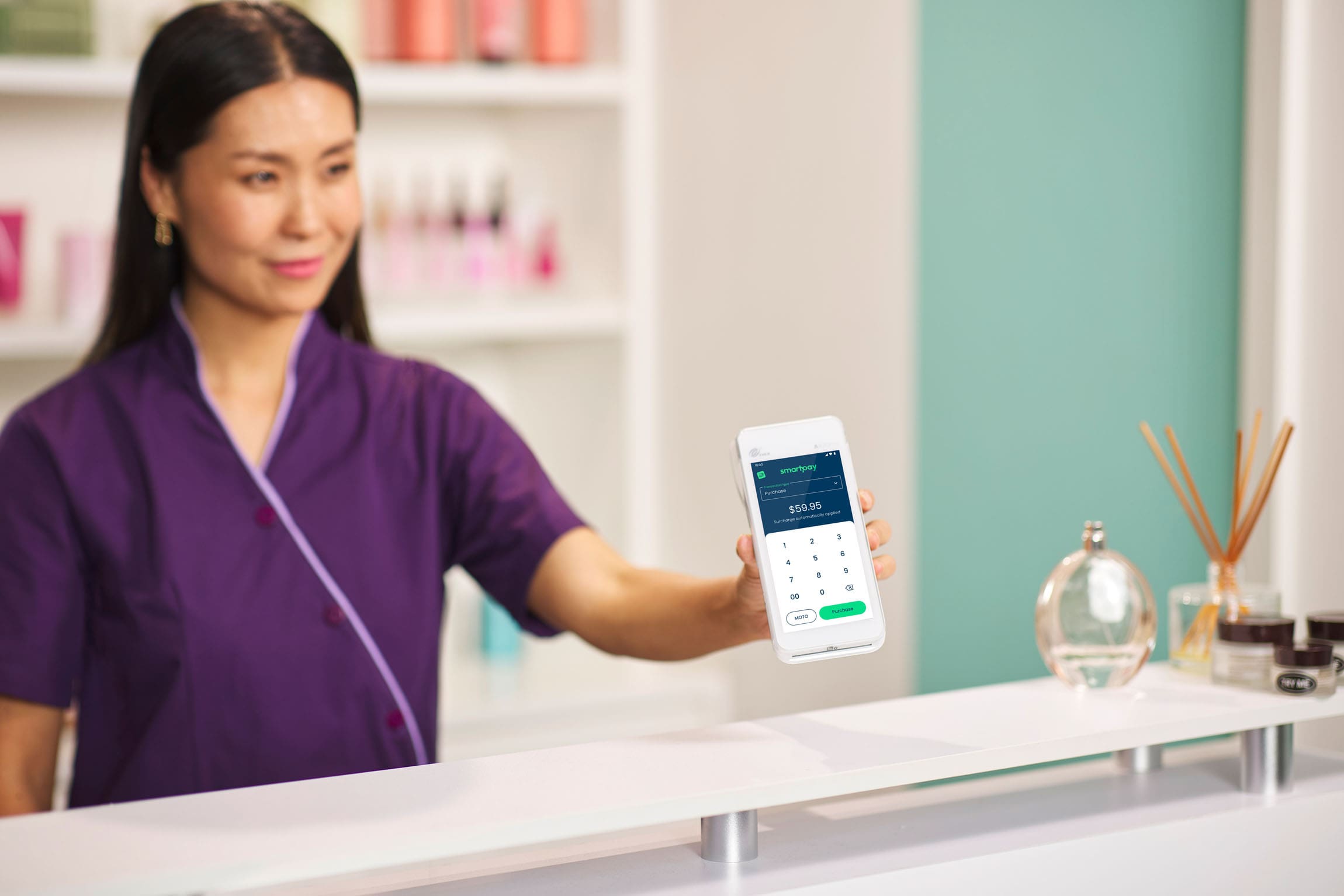 Women holding Android terminal out at a beauty salon