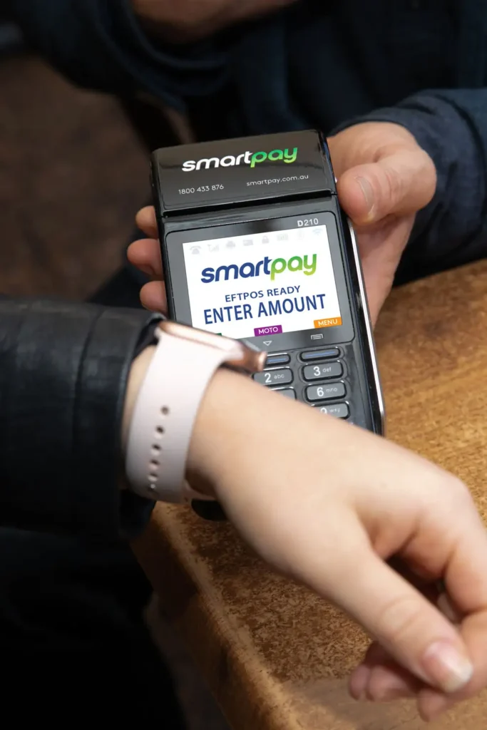 Customer paying with their smart watch on mobile eftpos terminal