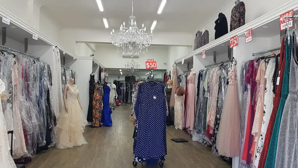 dress shop with multiple dresses on display
