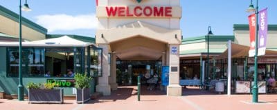 Front of shopping centre with Welcome sign