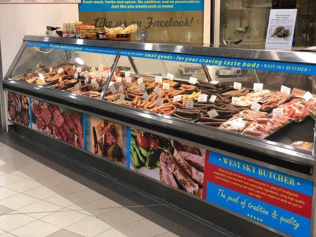 display case with meat at butcher